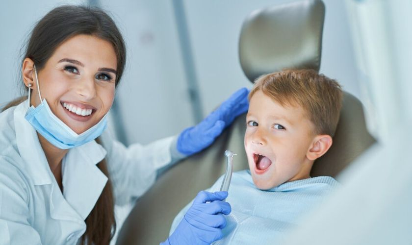 Pediatric dentist with child